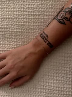 a woman's arm with a tattoo on it