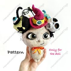 a crocheted doll with three little monsters on it's head and the words, pattern only for the doll