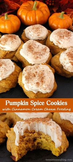 pumpkin spice cookies with cinnamon cream cheese frosting are on a black plate and surrounded by mini pumpkins