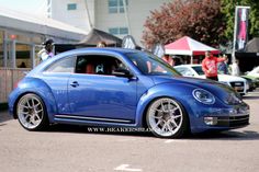 a blue car parked in front of a building