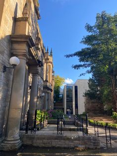 the entrance to an old building with columns