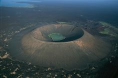 an aerial view of a crater in the middle of nowhere