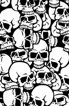 a lot of skulls that are all over the place with black and white ink on them