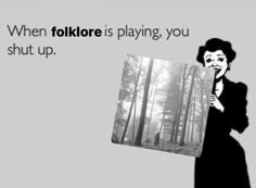 a woman holding up an image with trees in the background and text that reads, when folklore is playing, you shut up