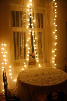 The combination of lights, decorations, and the wooden furniture creates an inviting atmosphere filled with warmth and holiday cheer. Hot Teas, Home Lights, Fairy Lights Decor, Lights Bathroom, Bathroom Lights, Studio Apt, Home Decor Quotes, Light Garland