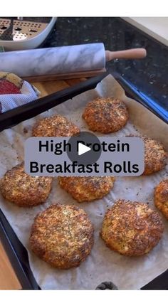 some food is sitting on top of a baking sheet with the words high protein breakfast rolls