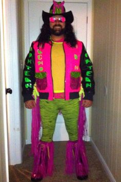 a man dressed up in pink and green with long hair, wearing a neon colored outfit