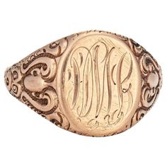 Lovely antique Victorian signet ring (circa 1880s to 1900s), crafted in 10 karat rose gold. From what we can decipher, the center mount is engraved with the initials "PML" The side shoulders feature a pretty scrolling design that terminates to the oval mount. The saddle of the ring is low and curves to the shape of the finger, rising 1.5mm from the finger (0.05 inches). The ring is in good condition with patina and wear evident. We have not cleaned the ring in order to preserve the patina and collector value. Particulars: Weight: 5.8 grams Stones: N/A. Size & Measurements: The ring is a size 11 (sizable). The mount measures 16mm in length (0.62 inches) and 12.5mm wide (0.49 inches), rising 1.5mm from the finger. Metal & Hallmark: 10 karat rose gold. The ring is not hallmarked though it has Luxury Vintage Engraved Initial Ring, Luxury Classic Round Engraved Ring, Luxury Victorian Gold Signet Ring, Luxury Engraved Oval Cabochon Jewelry, Victorian 14k Gold Engraved Collectible Ring, Victorian Oval Rings With Engraving Option, Victorian Oval Ring With Engraving Option, Victorian 14k Gold Engraved Ring, Victorian Engraved Oval Ring