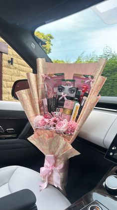 a bouquet of flowers sitting in the back seat of a car