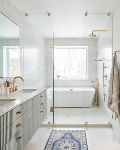 a bathroom with a rug, sink and bathtub