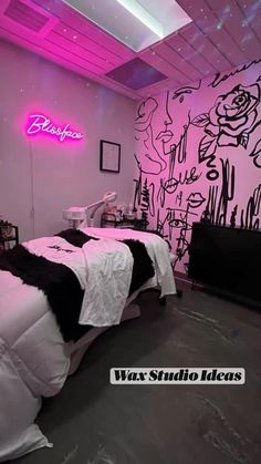 a bed room with two beds and a neon sign on the wall above it's headboard