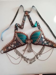 a bra with beads and chains attached to it