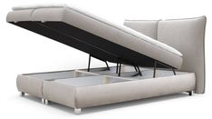 a couch with a pull out bed frame and mattress on it's back end