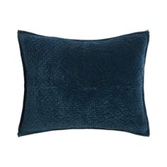 a dark blue pillow with a textured design on the front and back, sitting on a white background