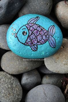 a rock with a fish painted on it