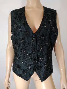 "Black Sequin Vest Women's Black Sequined Beaded Sparkly Glittery Disco Like New Condition Vintage by KEY LIME PIE  Size L Gorgeous glittery, funky disco super cool sequined vintage vest. Black sequin and beading on lace in floral pattern, full satin back with tie, black satin buttons down front, wear open or closed.  Excellent LIKE NEW condition. Easy to wear casual chic vintage for the disco sporting life. MEASUREMENTS: Length - 24.5\" Bust (underarms to underarms)  - 20\"x2 Waist - 19\"x2 Hips - 20\"x2 MODEL STATS: Ht. - 5' 8.5\" Bust - 35\" Waist - 25\" Hips - 35\" *Please check measurements to ensure proper fit and remember to allow extra room for movement.  You can compare these with something in your closet that fits you well.  We take great care to measure each piece. **Please note Carrie White, Sequin Vest, Vintage Vest, Lime Pie, Key Lime Pie, Vest Pattern, Vest Outfits, Chic Vintage, Key Lime