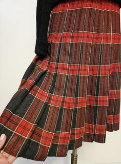 Tartan kilt stitched down pleats from the waist to hips, zipper worn side or back. Unlined   no label  wool fabric most likely  vintage from the 80's British made. Size 8 Waist 30" Hips  38" Length 26"  In excellent condition * Care Dry Clean Only   Photographed  with a black sweater  not available Retro Wool Bottoms For Fall, Retro Plaid Pleated Skirt For Fall, Vintage Lined Skirt For Fall, Vintage Plaid Pleated Skirt For Fall, Vintage Knee-length Winter Bottoms, Vintage Knee-length Bottoms For Winter, Vintage Accordion Pleats Skirt For Fall, Scottish Style Fitted Pleated Skirt For Fall, Fall Scottish Pleated Skirt