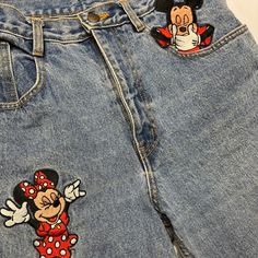 True Vintage Mickey Mouse Jeans Looking for a pair of conversational jeans that is perfect for everyday where, these are the jeans for you. While they may be vintage these babies are still a staple for the quirky souls out here.Jeans have a relaxed fit, but resemble a mom jean. Material: 100% Cotton Flaws: The Mickey Mouse patch looks as if it was repaired by a zig zag stitch. There are threads fraying.Item is vintage so there might be light staining but it doesn’t take away from the beauty of these jeans.Tag Size: Large (please refer to measurements for accuracy) All measurements are approximate inches, please compare to your actual measurements. Waist: 16 inches Hips: 20-20.5 inches Length: 39.5 inches Inseam: 28 inches Rise: 12.5 inches#mickeymouse #jeans #minnie #vintagedisney #disney Mickey Mouse Jeans, Zig Zag Stitch, Patch Jeans, Disney Patches, Jean Material, Vintage Mickey Mouse, Patched Jeans, Disney Lover, Mom Jean