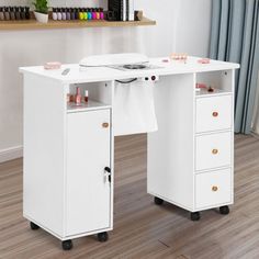 a white desk with two drawers on wheels