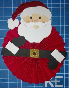 a paper fan with a santa clause on it