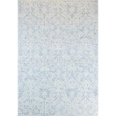 a blue and white rug with an intricate design on the bottom, in front of a white background