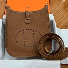 Hermes Evelyn Tpm (Size 16) In Gold With Gold Hardware In Tuarillion Maurice Brand New With Plastic Intact On Hardware, Dust Bag And Box Hermes Evelyn Bag Sizes, Hermes Evelyn Bag, Tokyo Shopping, Hermes Bags, Shopping List, Luggage Bags, Gold Hardware, Luxury Bags, Size 16