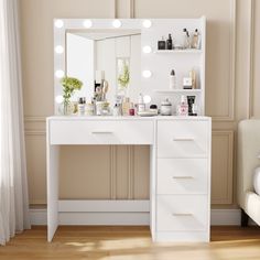 a white vanity with lights on it next to a chair