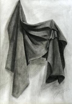 a black and white drawing of a scarf on the ground, with one folded up