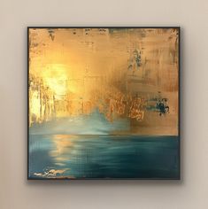 an abstract painting with gold and blue colors