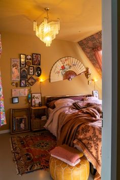 a bed room with a neatly made bed and a fan