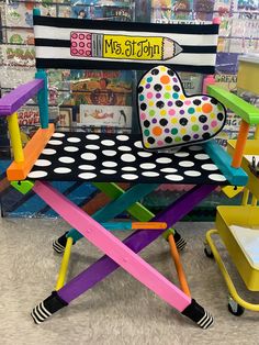 a chair made out of plastic and painted with polka dots