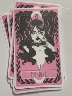 the devil playing cards are pink and black