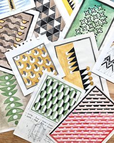 many different patterns and shapes are shown on the table with each one's own hand drawn