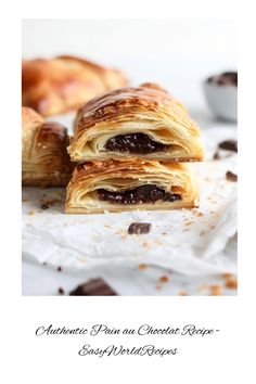 two croissants are stacked on top of each other, with chocolate filling