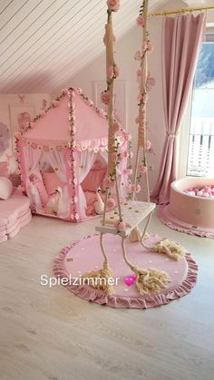 a room with pink furniture and accessories in it