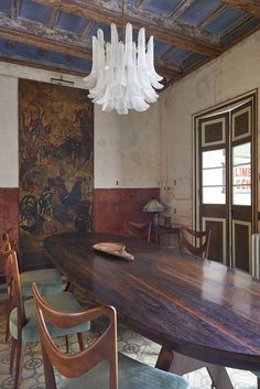 a large wooden table with chairs around it