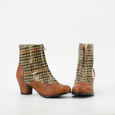 1940's Inspired Front Zip City Boot. Not Your Average Boot, This Stylish City Boot Is Sure To Take You On The Most Perfect Adventures. Proud To Be 100% Vegan Friendly. Upper Material: Faux Textured Leather + Laminated Plaid Lining Material: Man Made + Fabric / Sock Padded With Memory Foam For Comfort. Shaft Height: Measurements From Back Counter Where Heel Starts To Top Of Shaft (based on a size 6 shaft) 4 1/8" Inches Approximate Heel Height: 2 3/8" Inches Step In / Front Zipper Closure. Fit: Tr Retro High Heel Winter Boots, Retro High Heeled Winter Boots, Retro High-heeled Winter Boots, Retro High Heeled Boots For Winter, Retro Brown Winter Boots, Retro High Heel Fitted Boots, Retro Fitted High Heel Boots, Retro Fitted High Heeled Boots, Retro Vintage Brown Boots For Fall