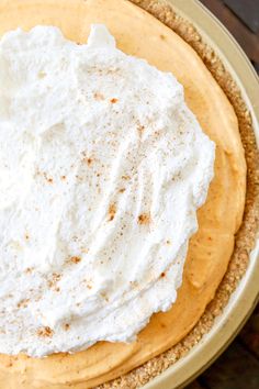 a pie with white frosting and cinnamon sprinkles