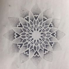 a black and white drawing of a flower with many petals in it's center