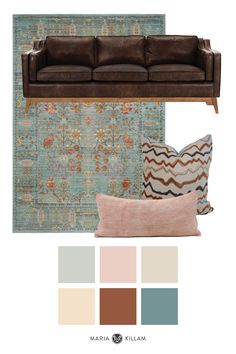 a living room with couches, pillows and rugs in shades of blue, green,