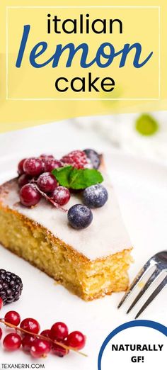 a white plate topped with a piece of cake covered in berries next to a fork