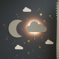 a night sky with clouds, stars and the moon lit up by a light that looks like a cloud