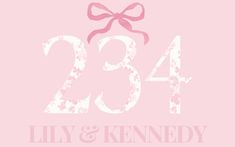 a pink wedding card with the number twenty three and a bow on it's side