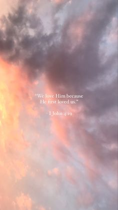 the sky is filled with pink clouds and a bible verse on it that reads, we love him because he first loved us