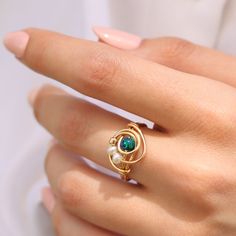 There is nothing ordinary about this handmade wrap ring. Set with a beautiful Atlantic Opal that goes well with any outfit. ☆ WHY THIS PIECE OF J E W E L R Y IS AWESOME! ☆ * Hand finished and made from high quality raw materials * Long lasting beauty & Timeless design * Set with a Atlantic Opal 5 mm, Fresh water pearls and a gold plated bead ♡ WRAPPING ♡ * All 23 Summers jewels arrive in a cute pouch or gift box so they are gift ready. DELIVERY ✉ * Most items are ready made but some are made Delicate Wire Wrapped Ring Jewelry, Wire Pearl Ring, Bead Wrapping, Gold Wire Wrapped Pearl Ring Gift, Adjustable Wire Wrapped Pearl Ring, Adjustable Wire Wrapped Round Pearl Ring, Diy Wire Jewelry Rings, Wire Jewelry Rings, Ring Pearl