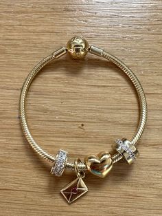 Gold charm bracelet inspo Pandora Pandora Mixed Metal Bracelet, Gold Silver Pandora Bracelet, Gold Charm Bracelet Pandora, Pandora Bracelet Outfit, Pandora Bracelet On Wrist, Gold And Silver Pandora Bracelet, Pandora Gold Charm Bracelet, Pandora Charms Bracelet, Pandora Necklace Charms