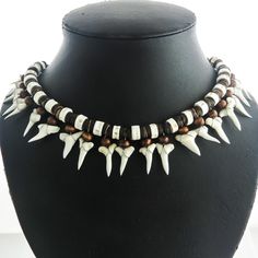 "Awesome Unisex 21pc Mako Shark Tooth Surfer Bone Brown Heishi Beads Necklace  If you like lots of shark teeth you are at the right place. We carry some of the coolest shark teeth necklaces on eBay at bargain prices. This unisex necklace has genuine teeth (exact number varies slightly depending on size). The necklace is accented (appropriately) with bone and coconut beads.  Lock Type:  Expands sliding knots Necklace Length:  18\" and up adjustable Shark Species:  Mako Tooth Size:  15-20mm (9/16-13/16\") Necklace Color:  Brown Necklace Material:  Shark tooth" Sand Tiger Shark Tooth Necklace, Heishi Beads Necklace, Shark Species, Shark Tooth Pendant, Mako Shark, Sterling Necklace, Beaded Art, Shark Tooth Necklace, Tooth Necklace