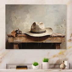 a painting of a hat sitting on top of a wooden table next to a plant