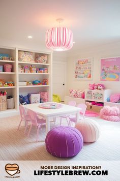 a child's room with pink and white furniture