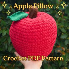 a crocheted apple pillow with a green leaf on it's tip and the words, apple pillow crochet pattern